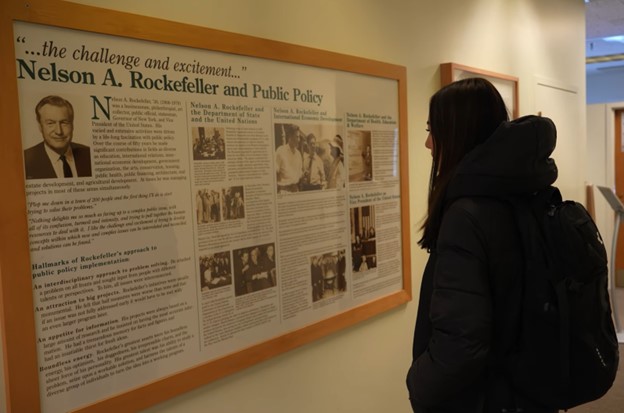 Image of student reading information about Nelson A. Rockefeller