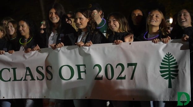 Students carrying class of 2027 banner